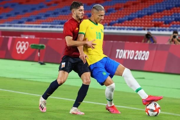 Richarlison of Team Brazil controls the ball against Oscar Gil of Team Spain in the first half during the men's gold medal match between Team Brazil...