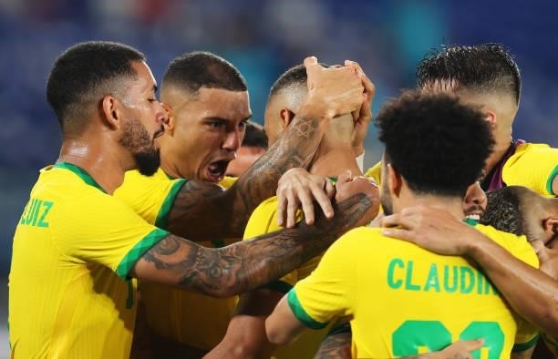 Matheus Cunha of Team Brazil celebrates with team mates after scoring their side's first goal during the Men's Gold Medal Match between Brazil and...