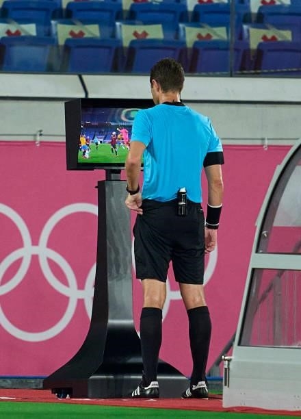 Match Referee, Chris Beath checks the VAR screen before awarding Team Brazil a penalty during the Men's Gold Medal Match between Team Brazil and Team...