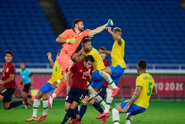 Matheus Cunha of Team Brazil is fouled by Unai Simon of Team Spain leading to a penalty being awarded during the Men's Gold Medal Match between Team...