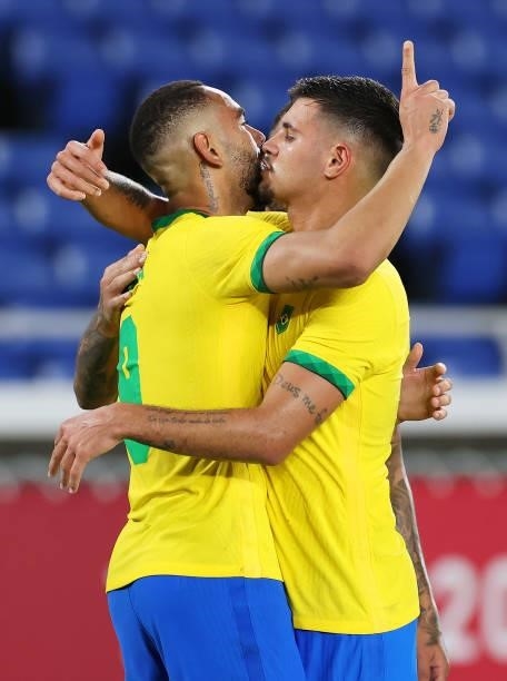 Matheus Cunha of Team Brazil celebrates with Bruno Guimaraes after scoring their side's first goal during the Men's Gold Medal Match between Brazil...