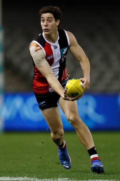 Nick Coffield of the Saints runs with the ball during the round 21 AFL match between St Kilda Saints and Sydney Swans at Marvel Stadium on August 07,...
