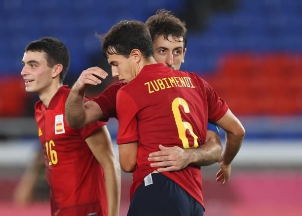 Mikel Oyarzabal of Team Spain celebrates with Martin Zubimendi after scoring their side's first goal during the Men's Gold Medal Match between Brazil...