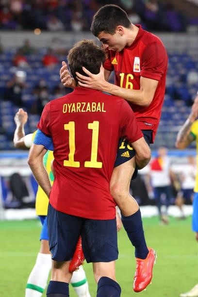 Mikel Oyarzabal celebrates with Pedri Gonzalez of Team Spain after scoring a goal in the second half to tie the game 1-1 during the men's gold medal...