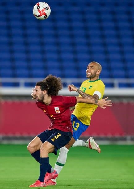 Daniel Alves of Team Brazil competes for the ball with Marc Cucurella of Team Spain during the Men's Gold Medal Match between Team Brazil and Team...