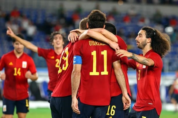 Mikel Oyarzabal of Team Spain celebrates with teammates after scoring a goal in the second half to tie the game 1-1 during the men's gold medal match...