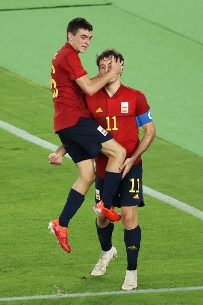 Mikel Oyarzabal of Team Spain celebrates with Pedri Gonzalez after scoring their side's first goal during the Men's Gold Medal Match between Brazil...