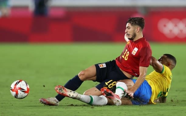 Oscar Gil of Team Spain is challenged by Carlos Diego of Team Brazil during the Men's Gold Medal Match between Brazil and Spain on day fifteen of the...