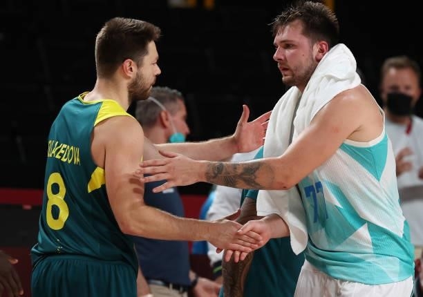 Luka Doncic of Team Slovenia and Matthew Dellavedova of Team Australia shakes hands after the Men's Basketball Bronze medal game on day fifteen of...