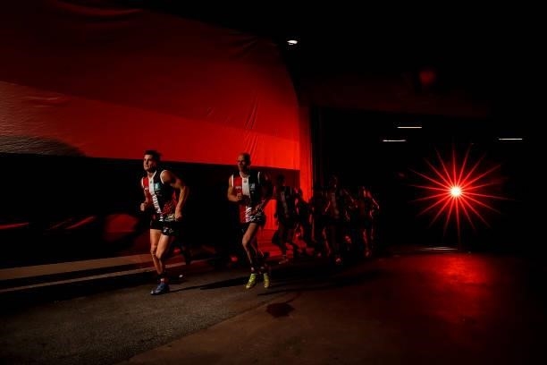 St Kilda players run out before the round 21 AFL match between St Kilda Saints and Sydney Swans at Marvel Stadium on August 07, 2021 in Melbourne,...