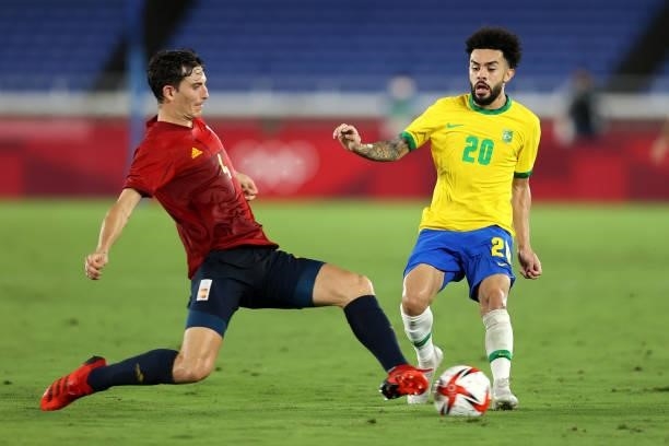 Claudinho of Team Brazil is challenged by Pau Torres of Team Spain during the Men's Gold Medal Match between Brazil and Spain on day fifteen of the...
