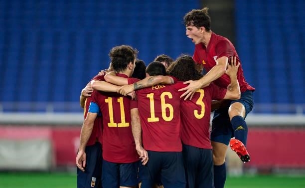 Mikel Oyarzabal of Team Spain celebrates with team mates after scoring his team's first goal during the Men's Gold Medal Match between Team Brazil...