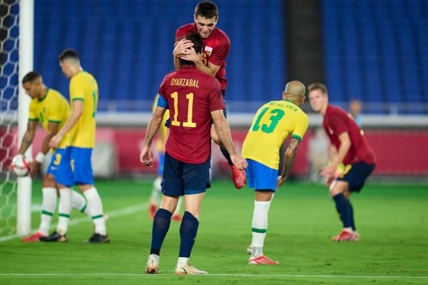 Mikel Oyarzabal of Team Spain celebrates with Pedro Gonzalez Lopez 'Pedri' of Team Spain scoring his team's first goal during the Men's Gold Medal...