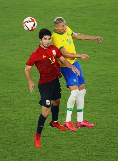 Carlos Soler of Team Spain competes for a header with Richarlison of Team Brazil during the Men's Gold Medal Match between Brazil and Spain on day...