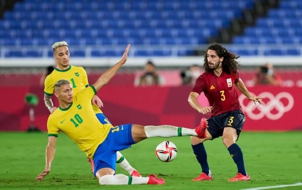 Richarlison De Andrade of Team Brazil competes for the ball with Marc Cucurella of Team Spain during the Men's Gold Medal Match between Team Brazil...
