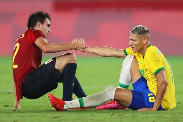 Richarlison of Team Brazil interacts with Eric Garcia of Team Spain following a tackle during the Men's Gold Medal Match between Brazil and Spain on...
