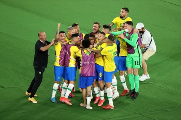 Malcom of Team Brazil celebrates with team mates after scoring their side's second goal during the Men's Gold Medal Match between Brazil and Spain on...
