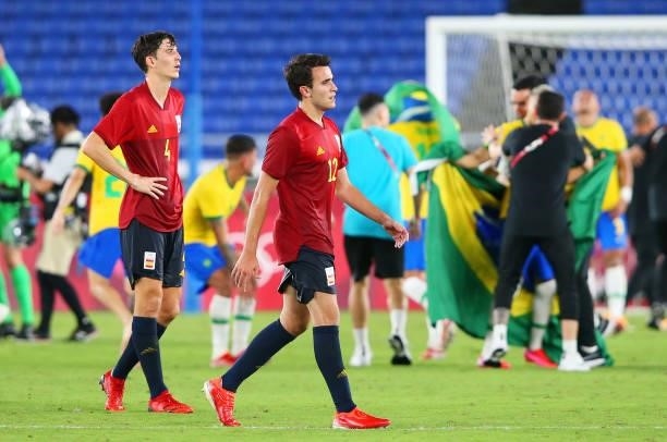 Pau Torres and Eric Garcia of Team Spain look dejected following defeat in the Men's Gold Medal Match between Brazil and Spain on day fifteen of the...