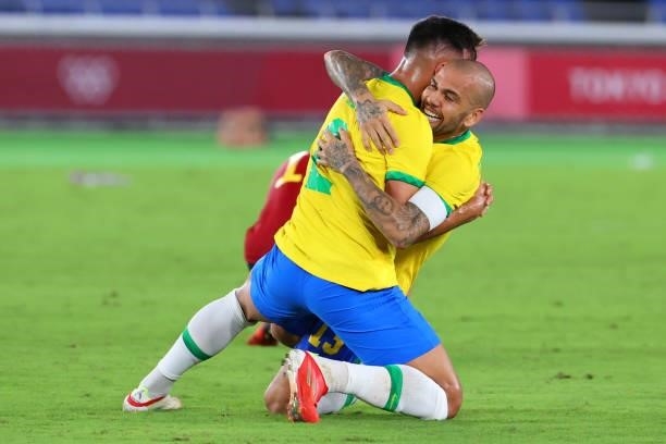 Gabriel Menino and Dani Alves of Team Brazil celebrate after defeating Team Spain 2-1 to win the men's gold medal match between Team Brazil and Team...