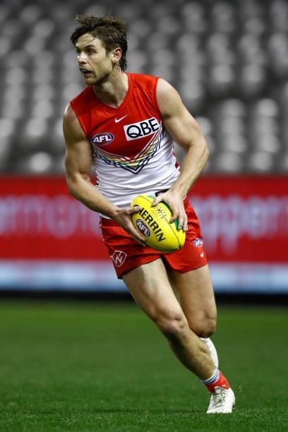 Dane Rampe of the Swans runs with the ball during the round 21 AFL match between St Kilda Saints and Sydney Swans at Marvel Stadium on August 07,...