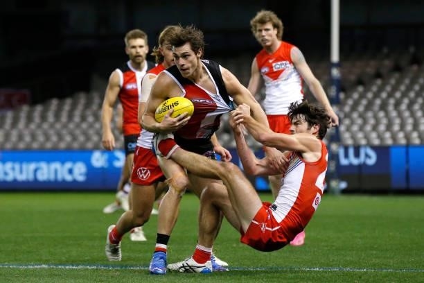 Jack Steele of the Saints breaks the tackle of George Hewett of the Swans during the round 21 AFL match between St Kilda Saints and Sydney Swans at...