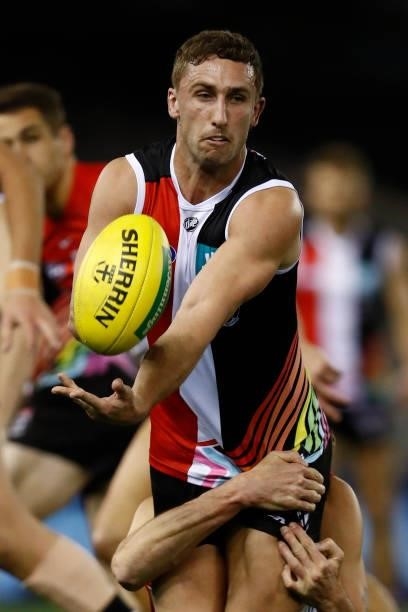 Luke Dunstan of the Saints handballs during the round 21 AFL match between St Kilda Saints and Sydney Swans at Marvel Stadium on August 07, 2021 in...