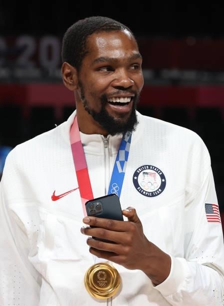 Kevin Durant of Team United States celebrates with his gold medal during the Men's Basketball medal ceremony on day fifteen of the Tokyo 2020 Olympic...