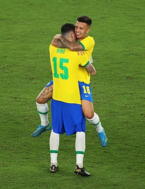 Henrique Matheus and Nino of Team Brazil celebrate their side's victory after the Men's Gold Medal Match between Brazil and Spain on day fifteen of...