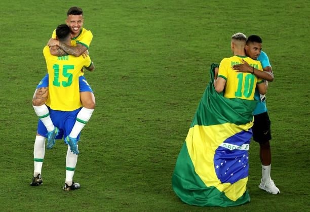 Henrique Matheus and Nino of Team Brazil celebrate their side's victory after the Men's Gold Medal Match between Brazil and Spain on day fifteen of...