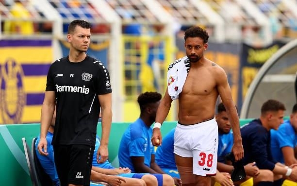 Karim Bellarabi of Bayer Leverkusen walks injured off the field during the DFB Cup first round match between 1. FC Lok Leipzig and Bayer Leverkusen...