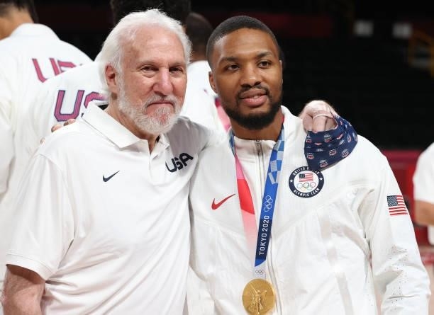 Team United States Head Coach Gregg Popovich and Damian Lillard pose for photographs during the Men's Basketball medal ceremony on day fifteen of the...