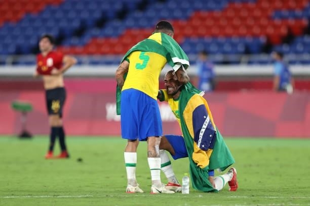 Dani Alves and Luiz Douglas of Team Brazil celebrate their side's victory after the Men's Gold Medal Match between Brazil and Spain on day fifteen of...