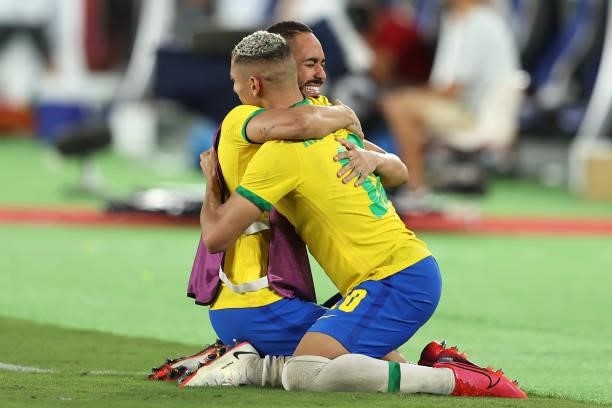 Matheus Cunha and Richarlison of Team Brazil celebrate their side's victory after the Men's Gold Medal Match between Brazil and Spain on day fifteen...