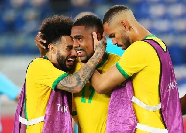 Malcom of Team Brazil celebrates with Claudinho and Matheus Cunha after scoring their side's second goal during the Men's Gold Medal Match between...
