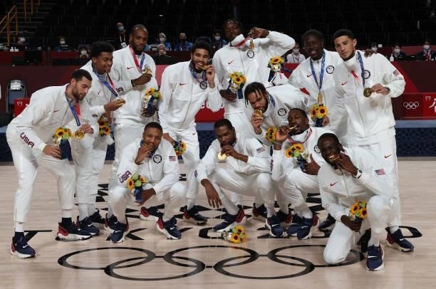 Team United States pose for photographs with their gold medals during the Men's Basketball medal ceremony on day fifteen of the Tokyo 2020 Olympic...