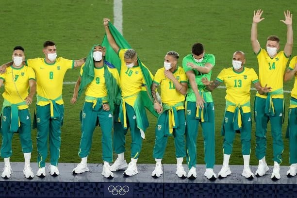 Gold medalists of Team Brazil celebrate on the podium during the Men's Football Competition Medal Ceremony on day fifteen of the Tokyo 2020 Olympic...