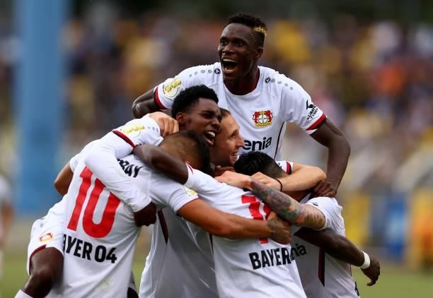 Kouakou Kossounou of Bayer Leverkusen celebrate with his team mates the 3rd goal during the DFB Cup first round match between 1. FC Lok Leipzig and...