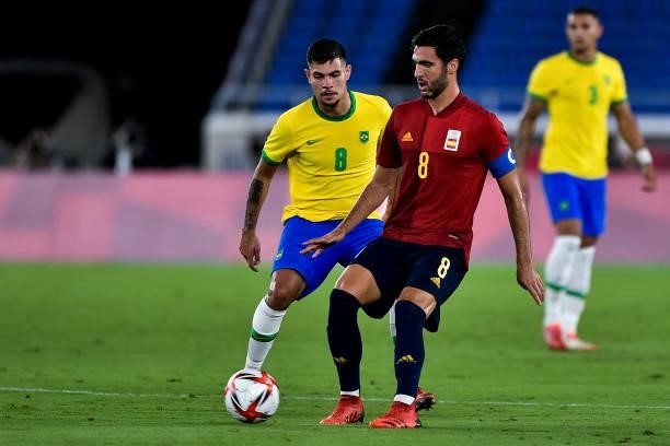 Bruno Guimaraes of Brazil and Mikel Merino of Spain during the Tokyo 2020 Olympic Mens Football Tournament Gold Medal Match between Brazil and Spain...