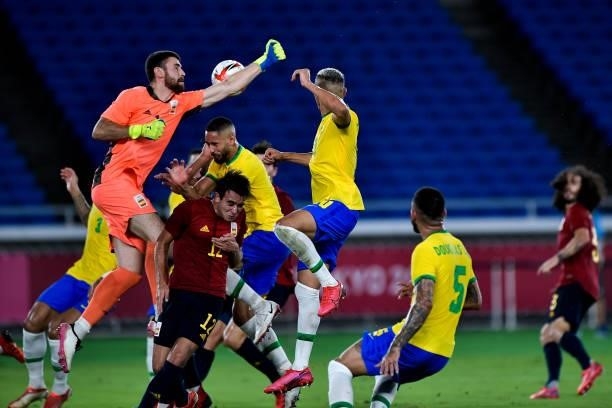 Unai Simon of Spain and Matheus Cunha of Brazil collide during the Tokyo 2020 Olympic Mens Football Tournament Gold Medal Match between Brazil and...