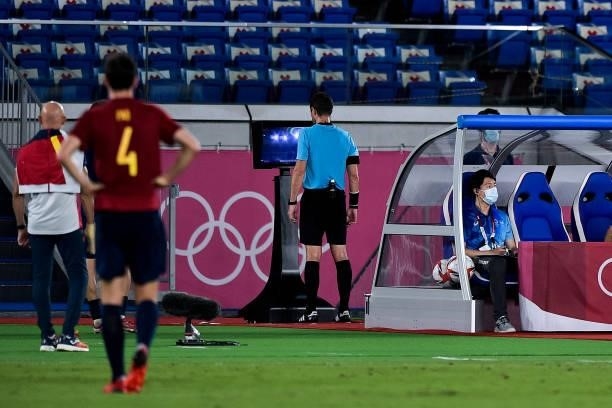 Referee Chris Beath of Australia checks the VAR screen during the Tokyo 2020 Olympic Mens Football Tournament Gold Medal Match between Brazil and...