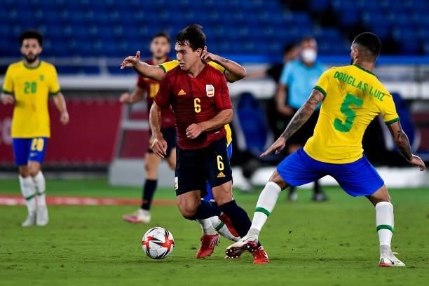 Martin Zubimendi of Spain and Douglas Luiz of Brazil during the Tokyo 2020 Olympic Mens Football Tournament Gold Medal Match between Brazil and Spain...