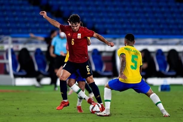 Martin Zubimendi of Spain and Douglas Luiz of Brazil during the Tokyo 2020 Olympic Mens Football Tournament Gold Medal Match between Brazil and Spain...