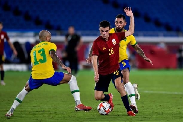 Dani Alves of Brazil and Pedri of Spain during the Tokyo 2020 Olympic Mens Football Tournament Gold Medal Match between Brazil and Spain at...