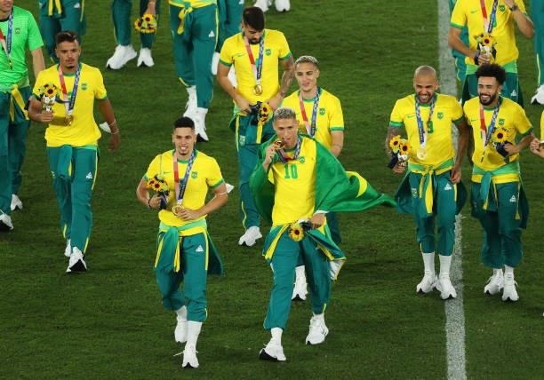 Gold medalists of Team Brazil celebrate with their gold medals during the Men's Football Competition Medal Ceremony on day fifteen of the Tokyo 2020...