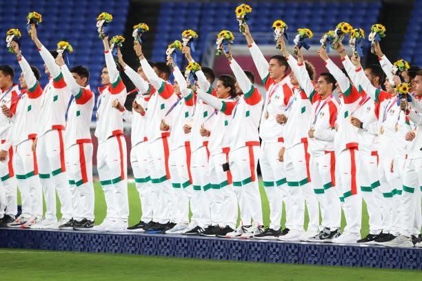 Team Mexico waves after receiving their bronze medals during the medal ceremony at International Stadium Yokohama on August 07, 2021 in Yokohama,...
