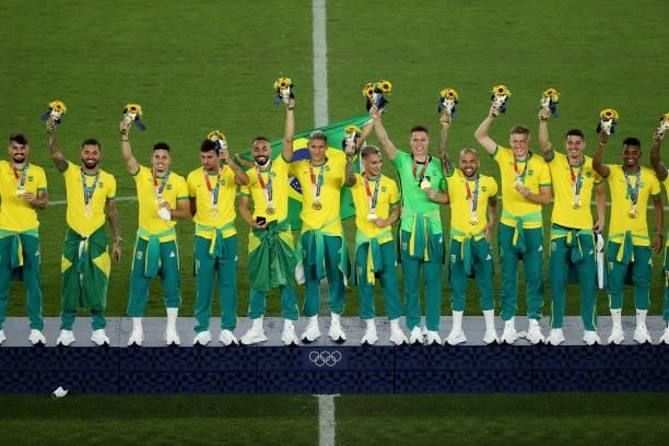 Gold medalists of Team Brazil celebrate on the podium during the Men's Football Competition Medal Ceremony on day fifteen of the Tokyo 2020 Olympic...