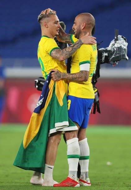 Antony and Dani Alves of Team Brazil celebrate their side's victory after the Men's Gold Medal Match between Brazil and Spain on day fifteen of the...