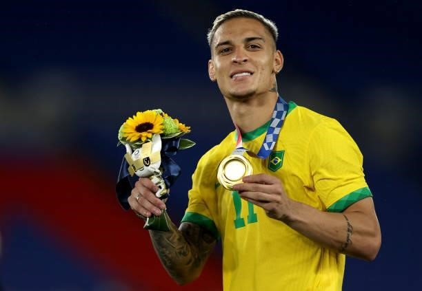 Gold medalist Antony of Team Brazil celebrates with their gold medal during the Men's Football Competition Medal Ceremony on day fifteen of the Tokyo...