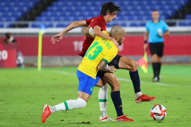 Dani Alves of Team Brazil and Bryan Gil of Team Spain battle for possession during the second period of extra time during the men's gold medal match...