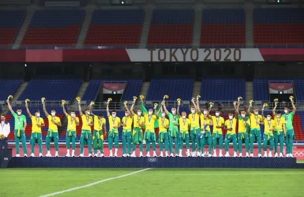 Gold medalists of Team Brazil celebrate on the podium with their gold medals during the Men's Football Competition Medal Ceremony on day fifteen of...